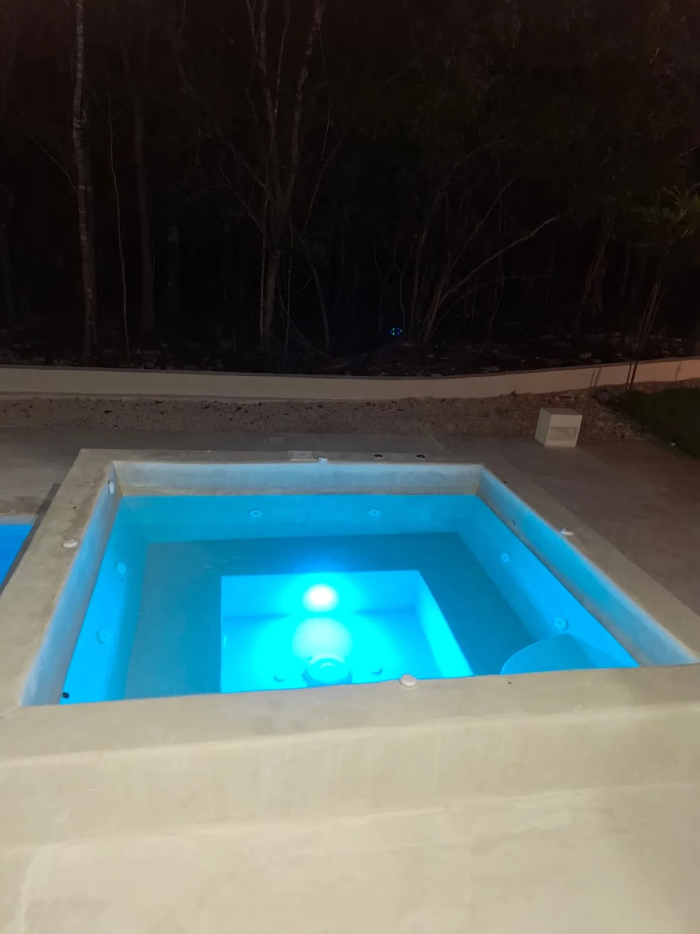 Sunken spa glowing after dark